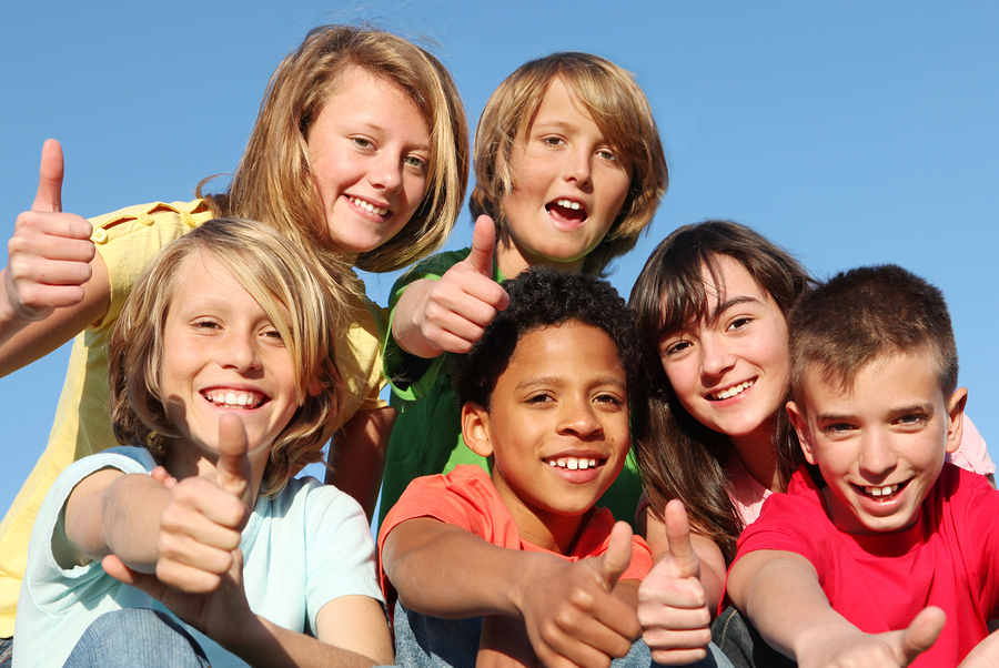 bigstock-happy-kids-with-thumbs-up-16236434